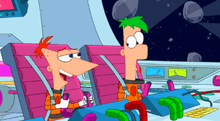Two cartoon characters sit in spiral chairs, holding controls on a large control panel. Behind them is the motif of a spaceship with a window showing outer space. The characters are young, Caucasian boys wearing orange spacesuits. The one to the left has red hair and a triangular face and is speaking. The one to the left is tall with a rectangular face and green hair and a closed mouth.