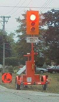 Portable, Solar Powered, Traffic Light used when construction workers must narrow a 2way street to a single lane and must emplace traffic controls for safety.
