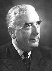 Menzies was thickset elderly Anglo-Saxon man, cleanshaven and wearing a suit.