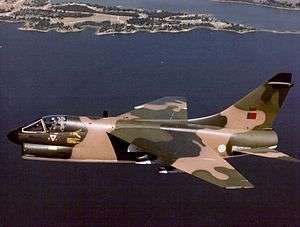 Camouflaged Portuguese A-7P Corsair II in flight over the ocean