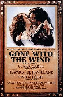 A film poster showing a man and a woman in a passionate embrace.