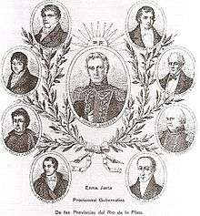 Allegoric images of the 7 members of the Primera Junta, arranged in a scheme freely similar to the Argentine coat of Arms. An icon of the president of the Junta is in a big oval in the middle, with a sun over it. A crown of laurel surrounds it, with attached smaller ovals with the icons of the other members of the Junta.