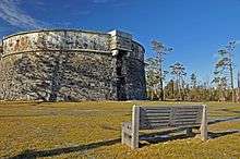 Prince of Wales martello tower with park bench in foreground