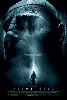 A female figure in silhouette stands before an enormous statue of a humanoid head. Text at the middle of the poster reveals the tagline "The Search For Our Beginning Could Lead To Our End". Text at the bottom of the poster reveals the title, production credits and rating.