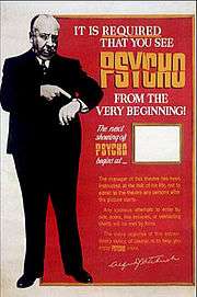 A large image of Hitchcock pointing at his watch. The words at the other side of the poster say "It is required that you see Psycho from the very beginning." There is a space for theatre staff to advertise the start of the next showing.