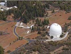 PTI is located atop Palomar Mountain, next to the large white dome of the historic 5 m Hale Telescope.