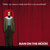Jim Carrey as Andy Kaufman standing in front of a large red curtain with details about the album imposed on top of the cover