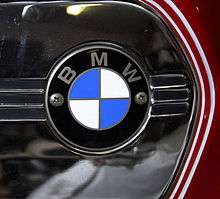 Closeup of BMW roundel badge on a part-painted and polished chrome fuel tank side panel