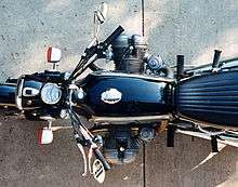 Top-down view of a black R75/5 showing that the cylinders which protrude out of each side of the bike are not directly opposite each other