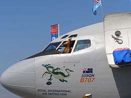 Boeing 707 nose and cockpit with toy kangaroo at open window and cartoon of a dragon on the fuselage, along with the words "33SQN B707", "Castlereagh" and "Royal International Air Tattoo 2006"