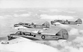 Three twin-engined military monoplanes in flight