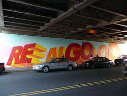 Mural on 63rd Drive at the LIRR overpass. The words "Real Good" are painted onto the mural.