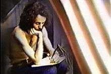 Image of Ra McGuire songwriting during 1975 US tour.