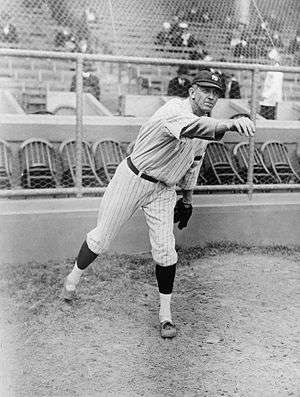 Raymond Benjamin Caldwell, Yankee pitcher, full-length portrait, facing right, with right arm extended outward after throwing baseball.