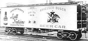 Photograph of an early refrigerated railroad car with Anheuser-Busch beer advertisements