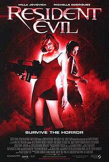 A black and red picture shows Alice standing back to back with Rain. Alice is holding a machine gun and wearing a red dress, cutaway showing a skirt. The tagline below reads "Survive the horror".