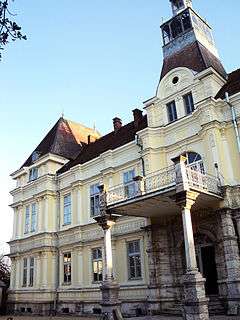 French-style residential building with a two wings on either side and a taller central section