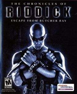 A bald man holding two knives and wearing black clothing, chains, and goggles. The man is in front of a black background with "The Chronicles of Riddick: Escape from Butcher Bay" over his head. The ESRB M rating is shown on the bottom left corner and the Vivendi Games logo is on the bottom right corner.