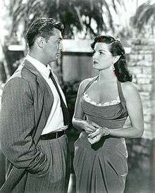 Black and white promotional image of Jane Russell (right) and Robert Mitchum in the 1951 movie His Kind of Woman