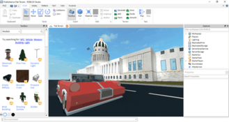 What's shown here is ROBLOX Studio 2016, an image of a car on the road passing a government building