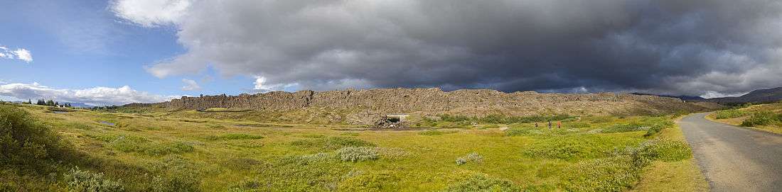 Panorama of Þingvellir in Summer from the opposite side showing the magnitude of the Rock of Law.