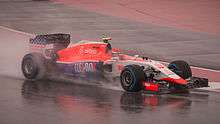 A picture of Alexander Rossi driving a Marussia MR03B Formula One car during the 2015 United States Grand Prix.