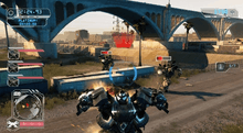 Screenshot of gameplay, showing the heads up display, and the Autobot Ironhide attacking Decepticons under a highway bridge.