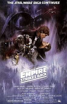 . This poster shows a montage of scenes from the movie. Dominating the background is the dark visage of Darth Vader; in the foreground, Luke Skywalker sits astride a tauntaun; Han Solo and Princess Leia gaze at each other while in a romantic embrace; Chewbacca, R 2-D 2, and C-3PO round out the montage.