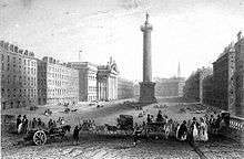 Artwork of statue of Nelson on top of a Doric column in a broad street lined with buildings, with pedestrians and horses and cart on a bridge in the foreground