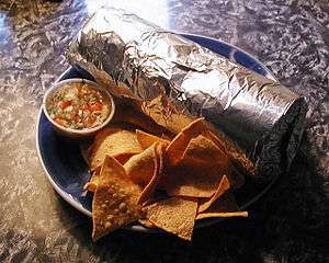 Plate with foil-wrapped burrito, chips and salsa