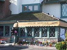 The Salon Meritage, with floral tributes following the shooting.