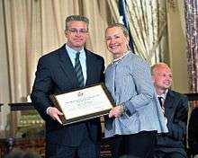 Gary Haugen receiving an award from Hillary Clinton in 2012