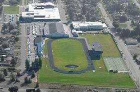 Sedro-Woolley High School aerial photograph looking east with muted background