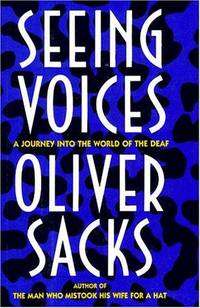 A book cover with text saying "Seeing Voices A Journey Into The World Of The Deaf Oliver Sacks Author of The Man Who Mistook His Wife For A Hat" on a blue and black background