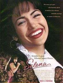 The film poster shows a woman grinning over a live concert. The background is dark with faint faces of those in attendance to the concert, with the names of the two lead actors. The middle has the film's name and tagline, and the bottom contains a list of the director's previous works, as well as the film's credits, rating, and release date.