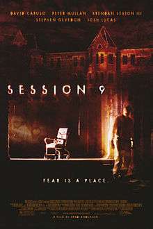 Dark, brown-tinted and horror-themed image of a man in an asbestos-removal suit (to the right side of the poster), with an image of a chair (in the middle of the image) and an image of a large castle-like building at the top of the image. The text "Session 9" is emboldened in white text in the middle of the image, and near the bottom of the image is written, "Fear is a place."