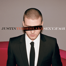 A young man with a buzz cut, wears a two-piece black suit, with a white shirt and black tie. A black horizontal rectangle covers his left eye, while his right blue eye can be seen. In capitals, "Justin", "Timberlake", and "SexyBack" is written in black, orange, and white font, respectively. The word "Back" is spelled backwards.