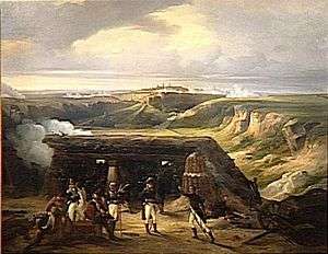 Painting shows an fortified artillery position with blue coated soldiers. In the distance is a city-fortress.
