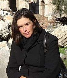 Sian Beilock sitting in front of ruins in Rome, Italy in December 2007
