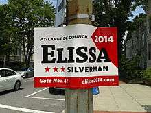 A red and white sign with a the name "Elissa" large and in black.