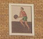 Terra cotta image of a basketball player
