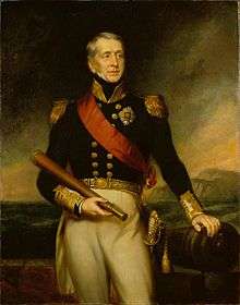 Three quarter-length portrait of a man, wearing a dark blue jacket with epaulettes and gold buttons, and white trousers. His left hand rests on a cannon, while he holds a telescope in his right