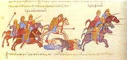 Medieval manuscript showing a group of horsemen on the left, armed with maces and lances, pursuing other horsemen who flee to the right