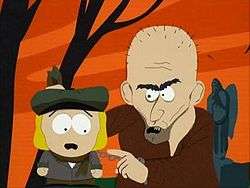 Screenshot of the character Pip, encountering an escaped convict, who grabs Pip by his collar.