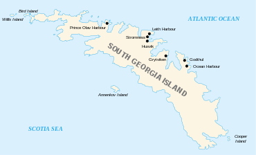  Outline map of the island of South Georgia and several offshore islands. South Georgia has a long irregular shape with many coves and deep bays. On the north shore the main whaling stations are marked: Prince Olav Harbour, Leith Harbour, Stromness, Husvik, Grytviken, Godtul and Ocean Harbour.