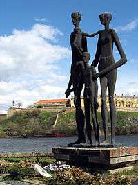 a sculpture in Novi Sad of three tall gaunt figures dedicated to the 1942 raid victims