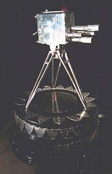 The trophy for the main award – a silver four-turret lens camera.