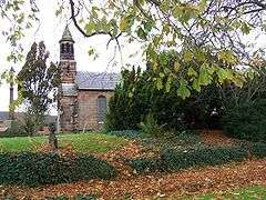 View of part of the church through foliage