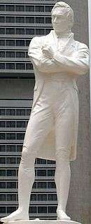 White statue of Sir Stamford Raffles standing
