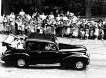 StateLibQld 1 213884 Queen Elizabeth II and Prince Philip wave to the crowds from a Humber car during their visit to Brisbane in 1954.jpg